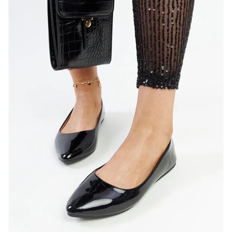 Black patent ballet flats by Brankica